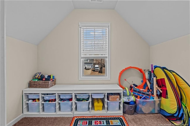 game room featuring lofted ceiling, visible vents, and carpet