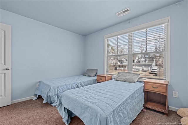 bedroom featuring carpet flooring, visible vents, and baseboards