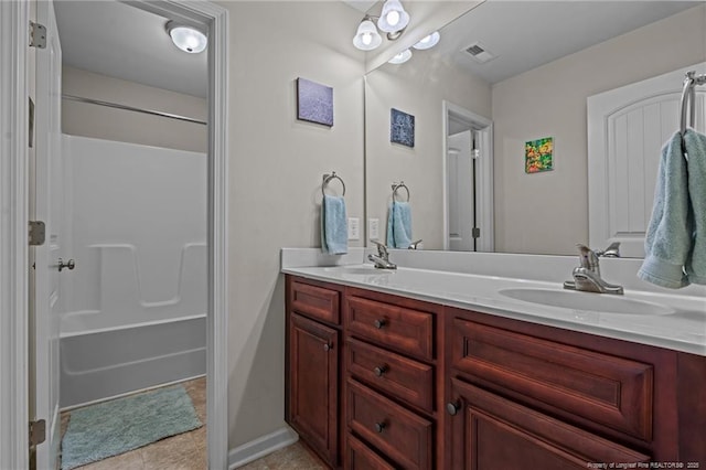 full bathroom featuring double vanity, visible vents, tile patterned floors, bathtub / shower combination, and a sink