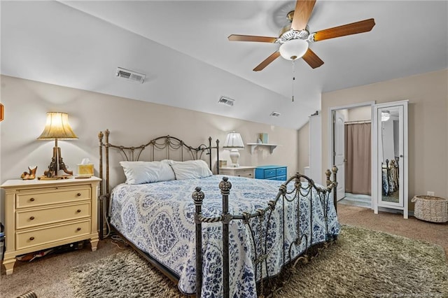 bedroom with lofted ceiling, carpet floors, and visible vents