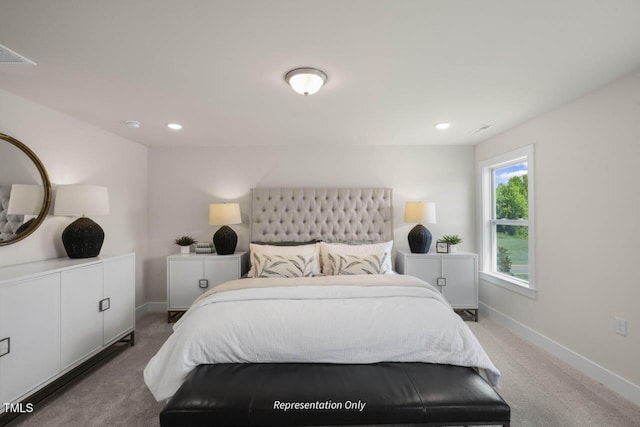 carpeted bedroom with visible vents, baseboards, and recessed lighting