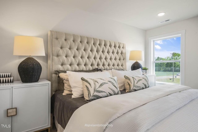 bedroom featuring visible vents