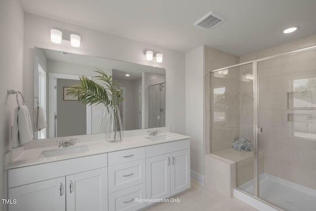 bathroom with a stall shower, visible vents, a sink, and double vanity