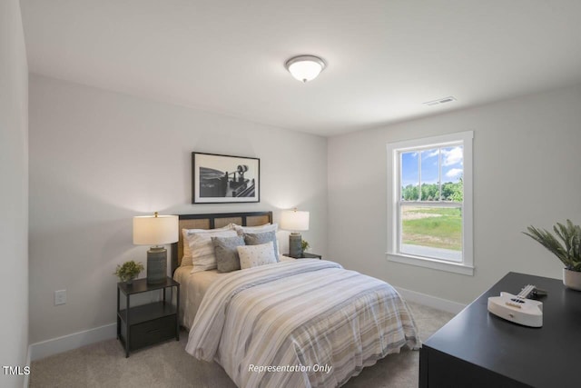 bedroom featuring carpet, visible vents, and baseboards