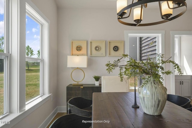 dining room with a healthy amount of sunlight and baseboards