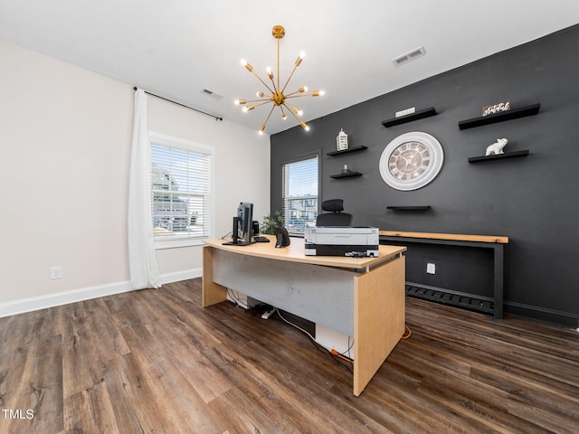 home office featuring dark wood-style floors, visible vents, a chandelier, and baseboards