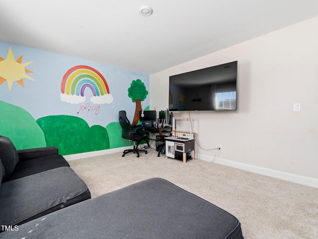 living area featuring carpet flooring and baseboards