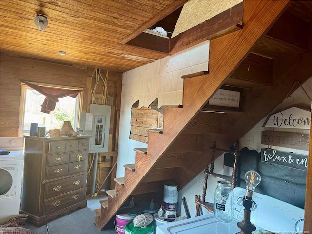 interior space featuring wooden ceiling, washer / dryer, and electric panel