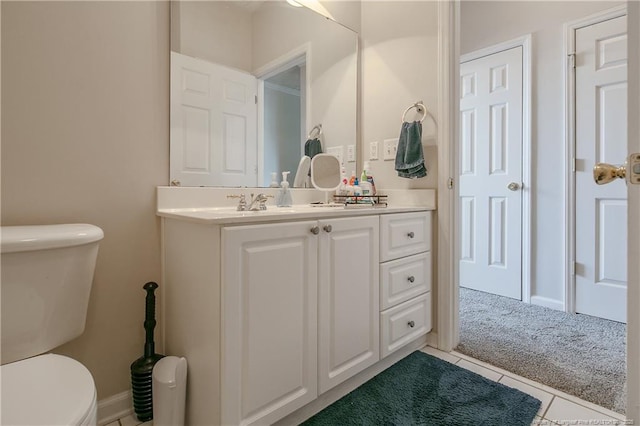 bathroom featuring vanity, toilet, and tile patterned floors