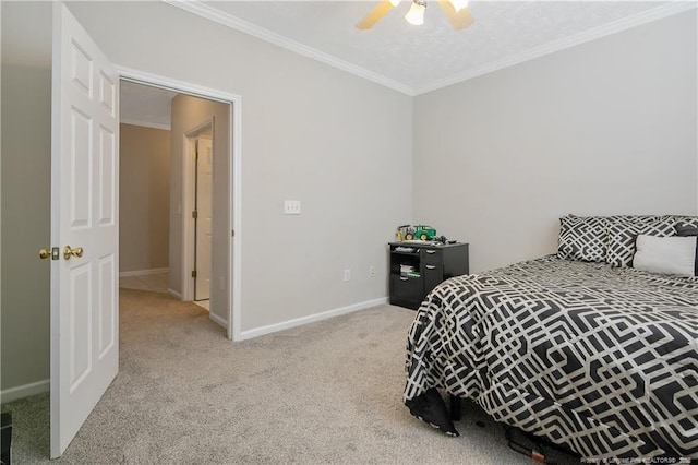 bedroom with baseboards, carpet floors, ceiling fan, and crown molding