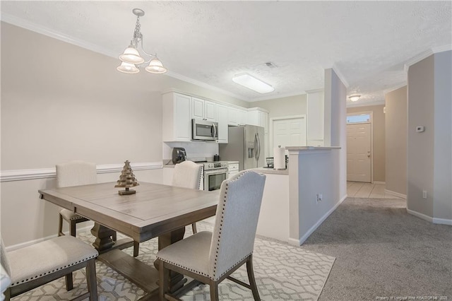 dining space featuring a textured ceiling, light carpet, crown molding, baseboards, and an inviting chandelier