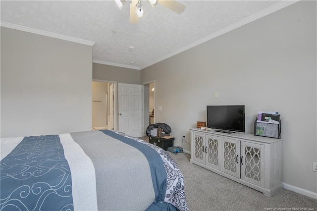 carpeted bedroom featuring baseboards, ceiling fan, a textured ceiling, and crown molding