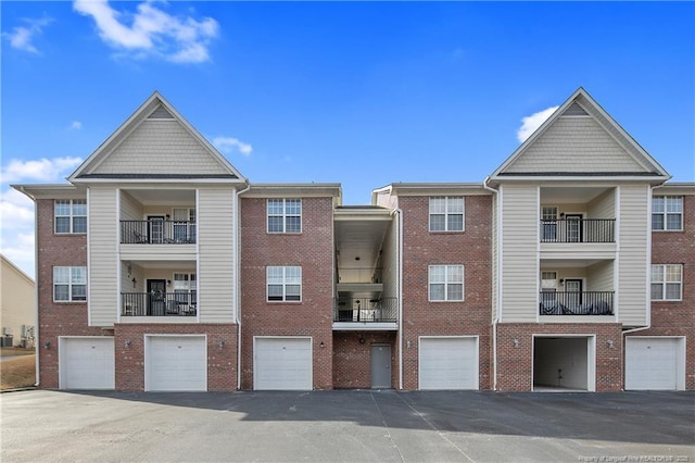 view of property with driveway and an attached garage