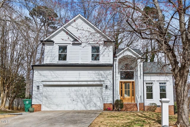 traditional-style house featuring a garage, driveway, and crawl space