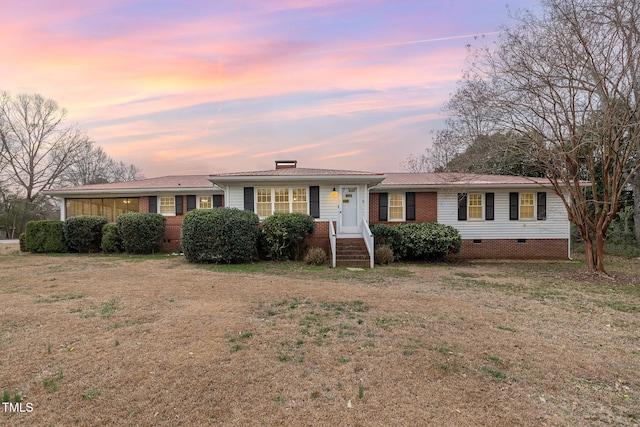 ranch-style home with brick siding and crawl space