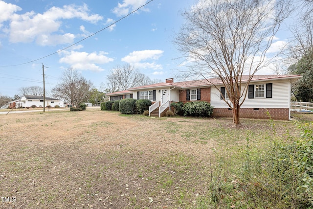 ranch-style house with crawl space, a chimney, a front lawn, and fence