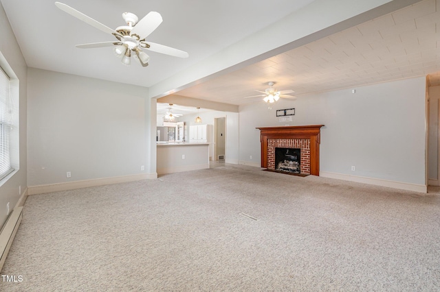 unfurnished living room with baseboards, carpet, a brick fireplace, and ceiling fan