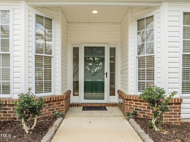 entrance to property with brick siding