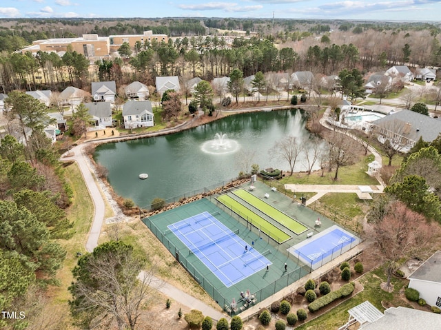 drone / aerial view featuring a water view and a residential view