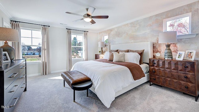 bedroom with visible vents, baseboards, a ceiling fan, light colored carpet, and crown molding