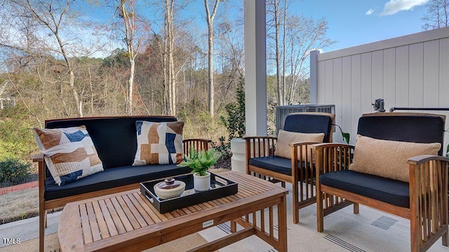 wooden deck with an outdoor living space