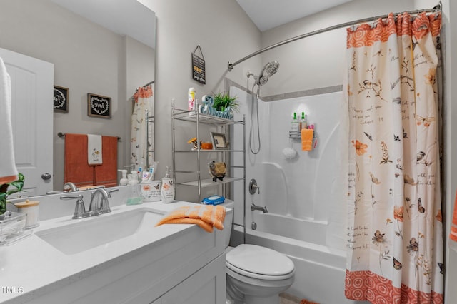 full bathroom featuring shower / tub combo, vanity, and toilet