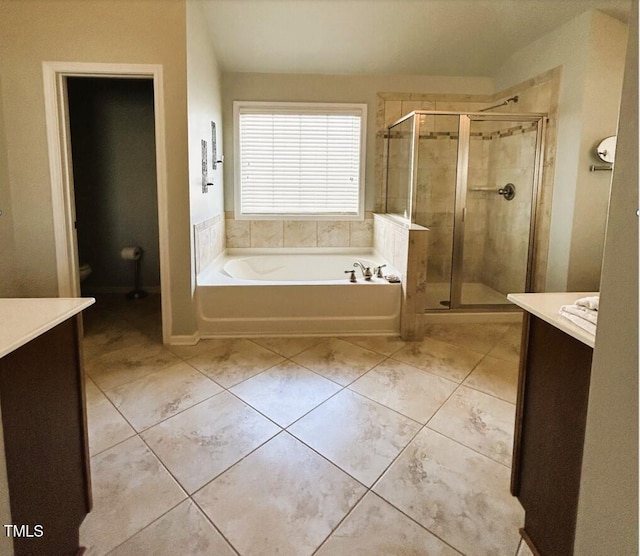 full bath with toilet, tile patterned flooring, vanity, a shower stall, and a bath