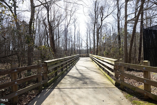 view of property's community featuring a forest view