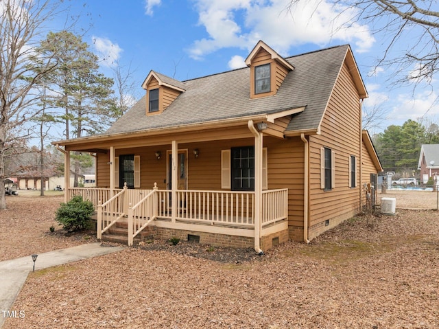 view of front of house featuring crawl space, covered porch, central air condition unit, and roof with shingles