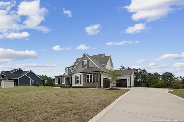 view of front of home featuring a garage, driveway, board and batten siding, and a front lawn