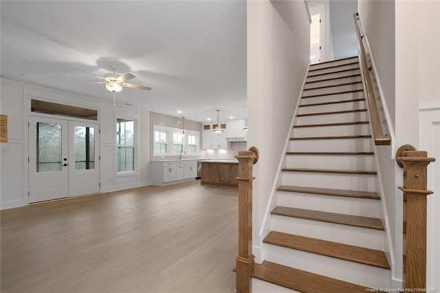 entryway featuring recessed lighting, light wood-style flooring, french doors, stairs, and ceiling fan