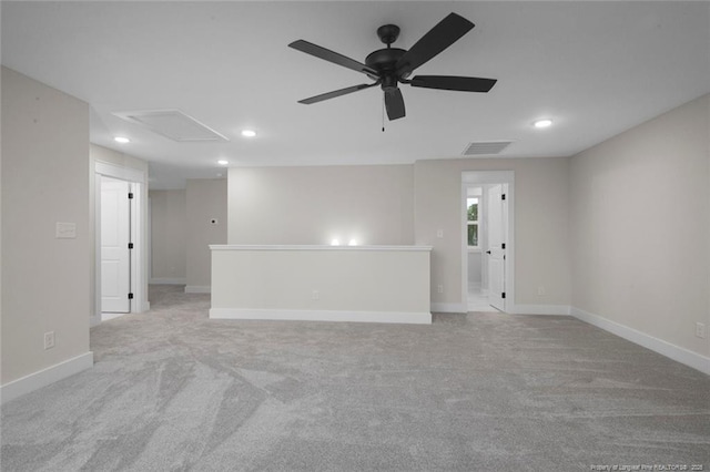 empty room with baseboards, recessed lighting, attic access, visible vents, and ceiling fan