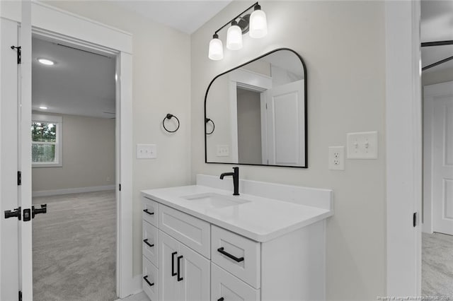 bathroom with vanity and baseboards