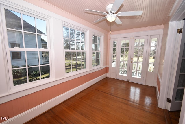 unfurnished sunroom with french doors and a ceiling fan