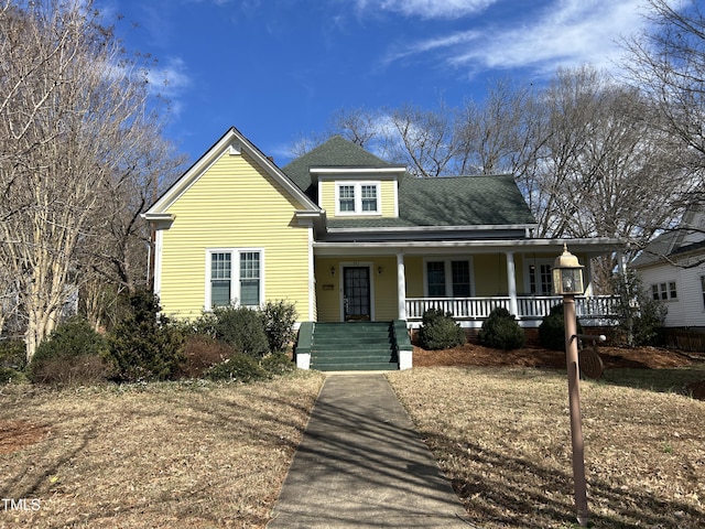 view of front of home featuring a porch and a shingled roof