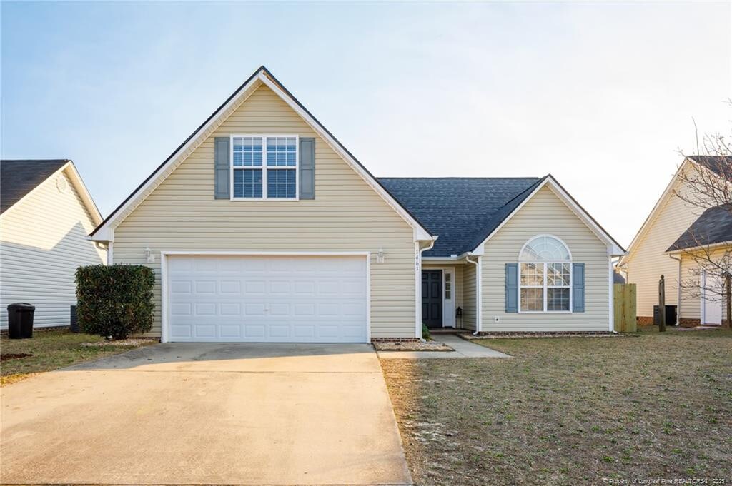 1461 Aultroy Dr, Fayetteville, NC 28306 - traditional-style house with driveway and a front lawn