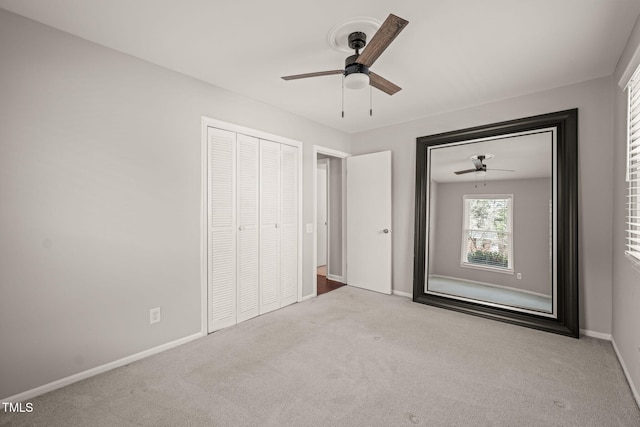 unfurnished bedroom with carpet flooring, ceiling fan, and baseboards