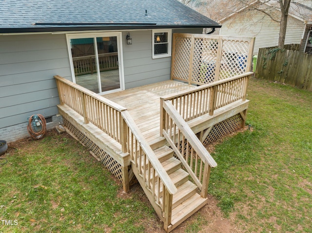 wooden terrace featuring stairway, a lawn, and fence