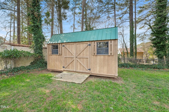 view of shed with fence