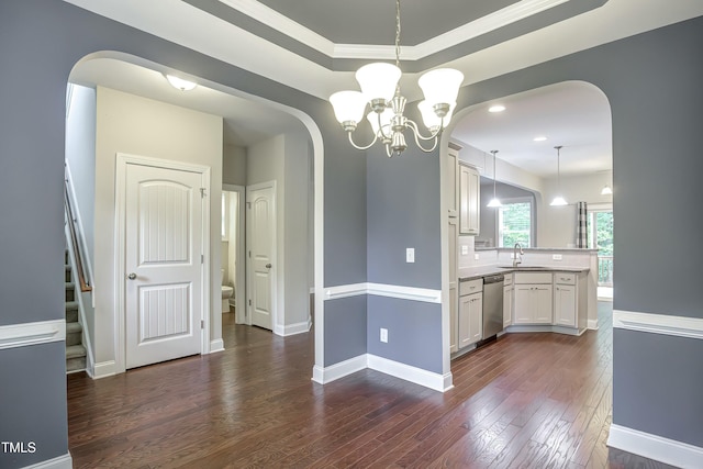 kitchen with dishwasher, dark wood-style flooring, arched walkways, and a sink