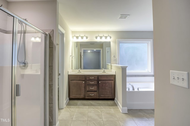 full bath featuring a stall shower, double vanity, a sink, and a bath