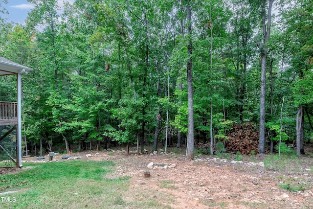 view of yard featuring a view of trees