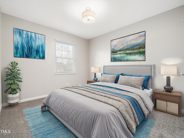 carpeted bedroom featuring baseboards