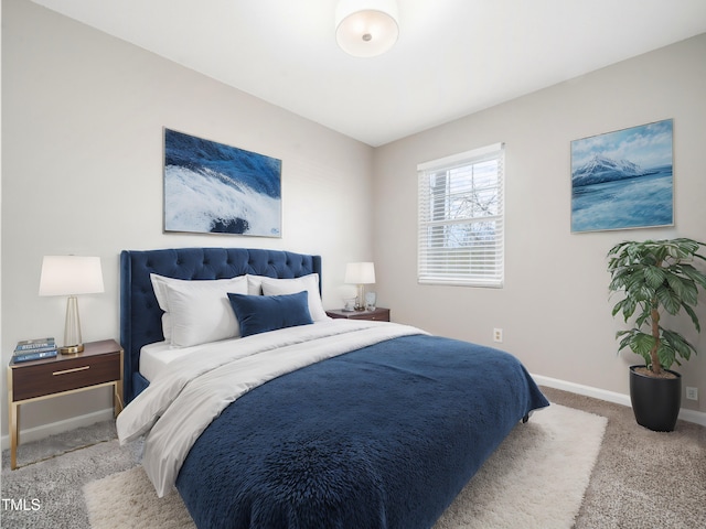 carpeted bedroom featuring baseboards