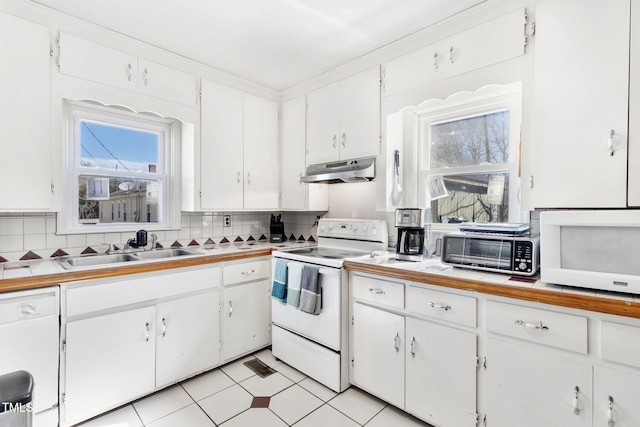 kitchen featuring backsplash, white cabinetry, a sink, white appliances, and under cabinet range hood