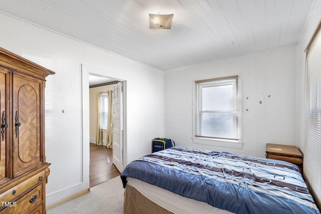 bedroom featuring multiple windows and baseboards