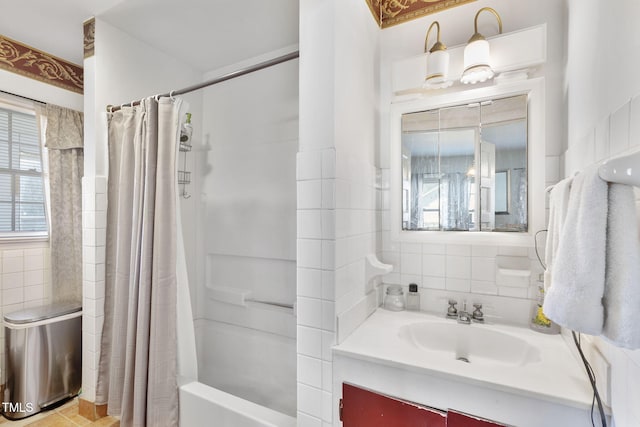 bathroom with shower / bathtub combination with curtain, backsplash, a wealth of natural light, and vanity