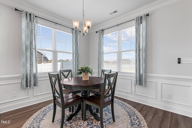 dining room with dark wood finished floors, visible vents, and plenty of natural light