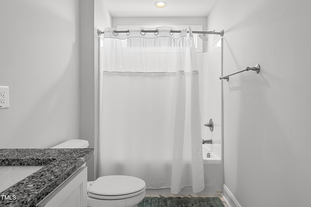 full bathroom featuring shower / tub combo, vanity, and toilet