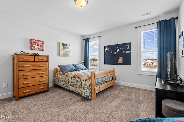 bedroom featuring carpet floors, baseboards, and visible vents